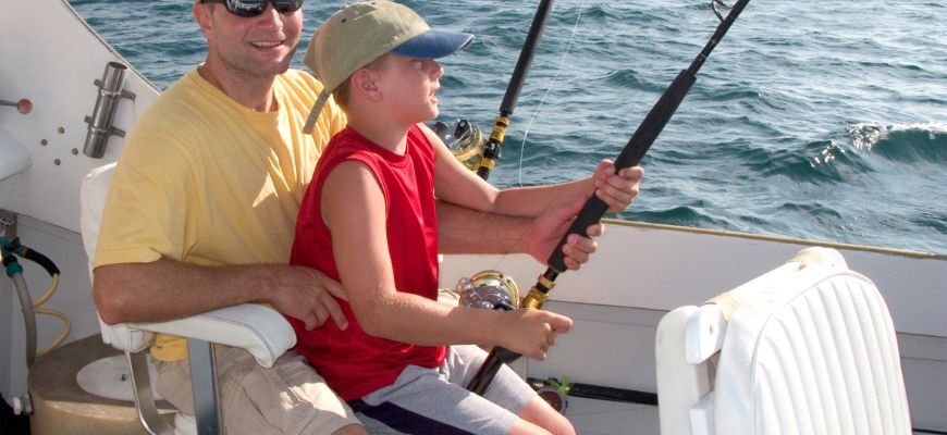 A picture of my son Jake reeling on his first striper